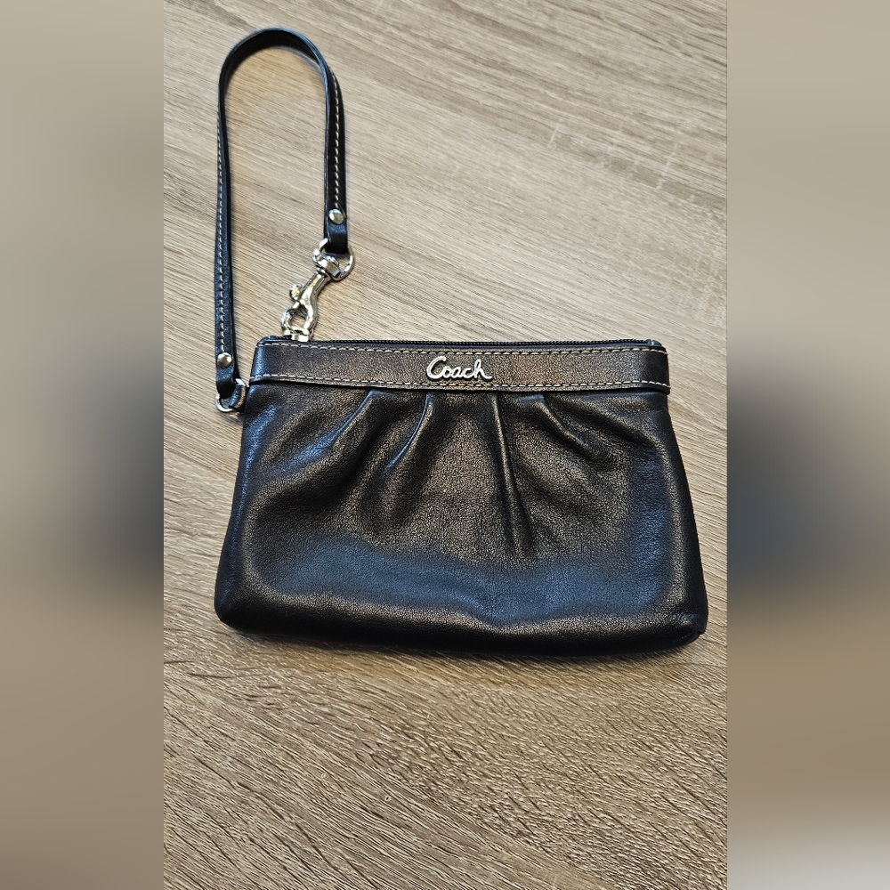 Coach Black wristlet.   Man made materials